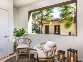 a room with two chairs and a table