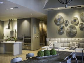 a living room filled with furniture and a kitchen