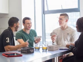 a group of friends playing cards at a table