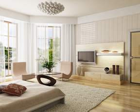 a bedroom with a bed and a tv