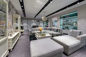 A modern furniture store with a variety of seating options.