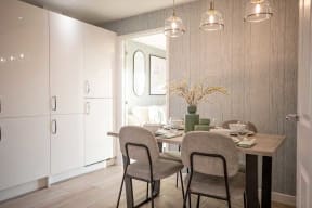 a dining room with a table and chairs
