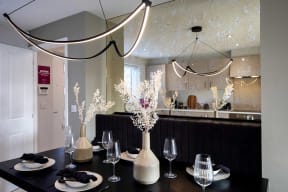 a dining room with a table and chairs