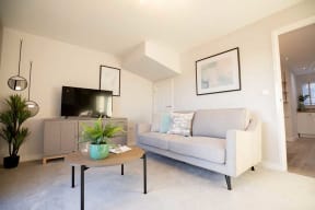 a living room with a couch and a table