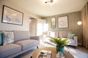 a living room with couches and a table
