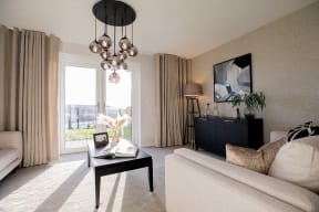 a living room with a white couch and a coffee table