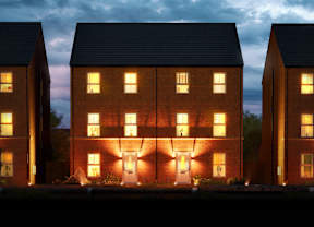 A row of houses with lit windows and doors.