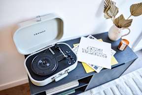 A Crosley record player is on a table with a note that says "Future Variations".