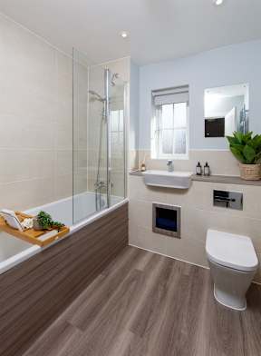 A modern bathroom with a walk-in shower and a toilet.