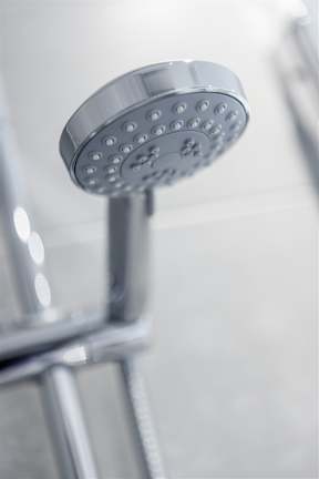 A close up of a shower head.