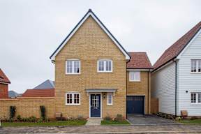 A two-story house with a blue garage door.