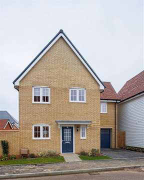 A two-story house with a blue door and windows.