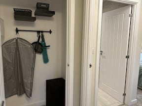 A white door is open to a hallway.