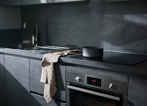 A modern kitchen with a stove and oven.