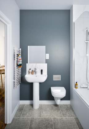 A bathroom with a white sink and toilet.