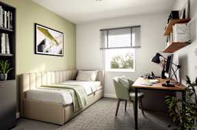 A bedroom with a bed, desk, and chair.