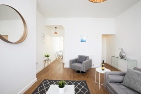 a living room with a couch and a table