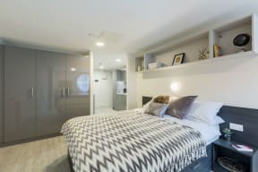 a bedroom with a bed and a closet