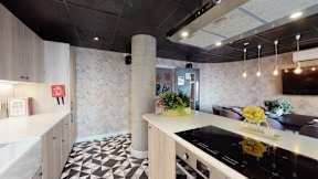 A kitchen with a black and white checkered floor.
