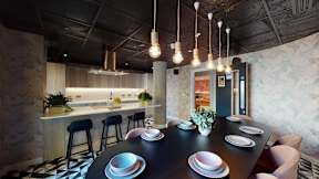A modern dining room with a black table and chairs.