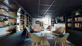 A room with a grey ceiling and a black floor with a table and chairs.