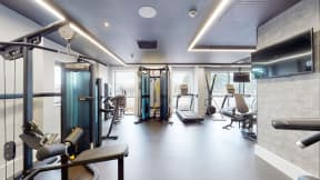 a gym with a lot of equipment in it