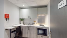 a kitchen with a sink and a microwave