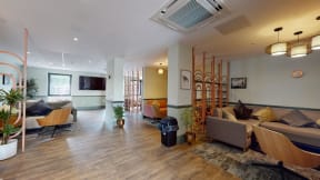 a living room with couches and a tv
