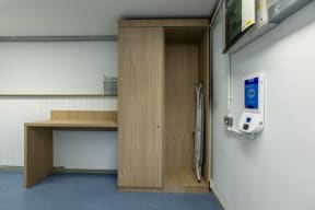 a patient room with a patient door and a desk