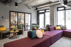 a living room with couches and chairs and a table