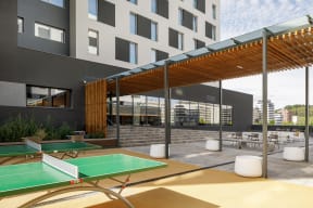 a rendering of a patio with ping pong tables