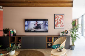 a living room with a tv on the wall
