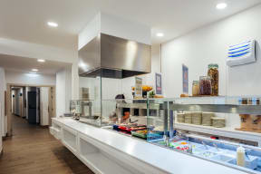 a view of a kitchen with a counter with food on it
