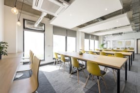 a large conference room with tables and chairs