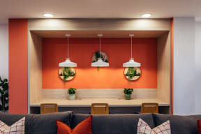 a room with a couch and colorful lights on the wall