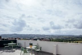 a view of the sky from a restaurant with tables and chairs
