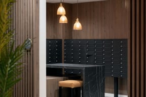 a black table and chairs in a room with wooden walls