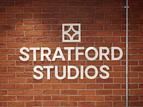 A brick wall with the words "Stratford Studios" written on it.