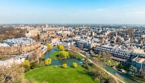 A cityscape with a river running through it at Origins Apartments, Cambridge