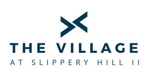 the logo for the village at slippery hill hillside
