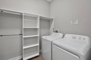 A white bathroom with a tub and sink.