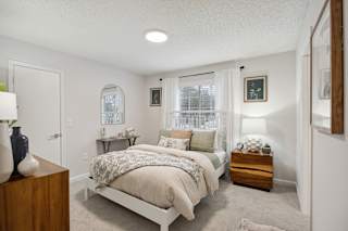 a bedroom with a bed and a window at St. Andrews Reserve, North Carolina, 28412
