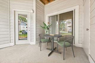 A patio with a table and chairs is shown.