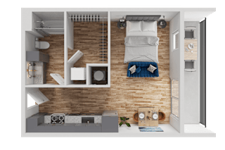 A small room with a bed, a table, and a chair.