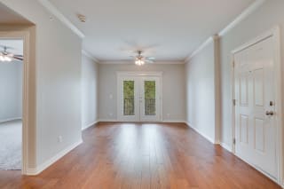 Spacious Living Room With Hardwood Floors & French Patio Doors
