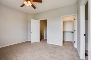 Carpeted Bedroom Featuring Two Walk-In Closets