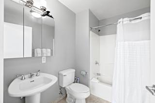 a bathroom with a sink toilet and bathtub