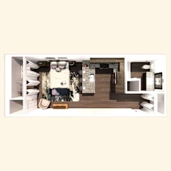 A small, neatly organized bedroom with a bed, nightstand, and a small desk.