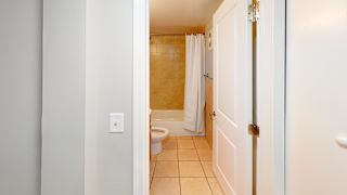 a bathroom with a toilet and a bathtub