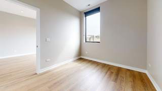 A room with wooden floors and a window.